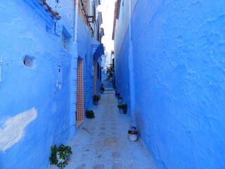 Fototapeta na wymiar Blue narrow street