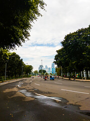 Central Jakarta, Indonesia - April 5th, 2021: Medan Merdeka Utara Street is a road that is close to the Indonesian National Monument or Monas in the city of Central Jakarta.