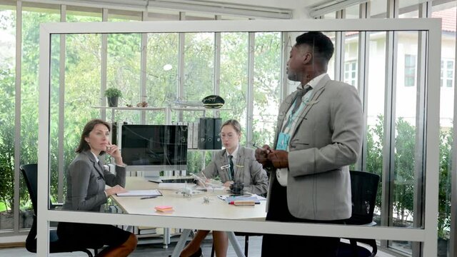 Young black African businessman presentation your aviation business plan on the whiteboard to your supervisors and office colleagues. aviation business concept