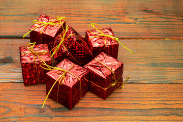 red christmas gift boxes on wooden background