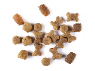 Dog food pile, dry granules for pets isolated on white background, top view