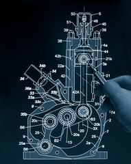 engineer working on computer at 2T motor prototype blueprint design