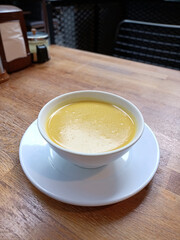 soup plate on wooden floor in restaurant