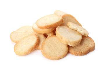 Pile of delicious crispy rusks on white background