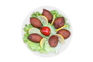 Kibbeh in a white serving dish, top view