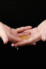 spreading chicken yolk on the palms