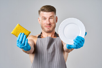 male athlete in aprons washing dishes service