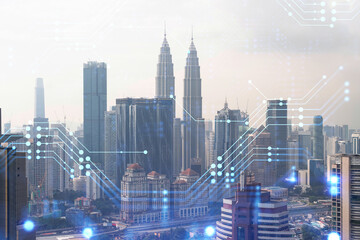 Technology hologram over panorama city view of Kuala Lumpur. KL is the largest tech hub in...