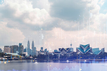 Forex and stock market chart hologram over panorama city view of Kuala Lumpur. KL is the financial center in Malaysia, Asia. The concept of international trading. Double exposure.