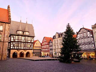 Naklejka premium View of Alsfeld town hall, Weinhaus and church on main square, Germany. Historic city in Hesse, Vogelsberg, with old medieval frame half-timbered houses on Christmas time and tree.