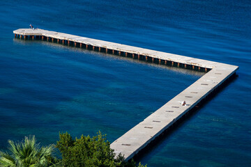 Aerial view of long jetty towards the ocean