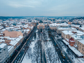 aerial view of snowed lviv center opera building