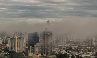 Bangkok, thailand -Aug 29, 2021 : An impressive aerial top view of skyscrapers at downtown Bangkok city in morning fog. No focus, specifically.
