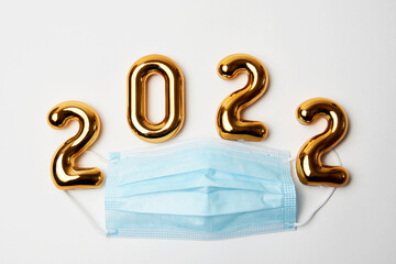 Happy New Year 2022 with medical mask on white background