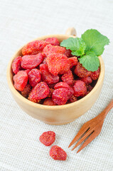 Dried Strawberries in wooden bowl.