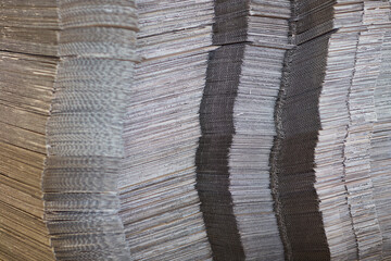 Closeup view of corrugated cardboard sheets, upcycling concept. Recyclable packaging material
