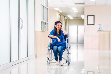 Portrait of smiling happy asian woman patient sitting on wheelchair looking at camera with health...