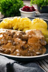 Grilled chicken breast with mushroom sauce.