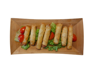 Top view fritters in bamboo plate on isolated white background. Traditional Turkish food, spring rolls