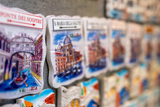 Venice travel destination souvenirs of various landmarks displayed in a row for sale to tourists