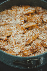 Close-up of raw apple pie in baking dish