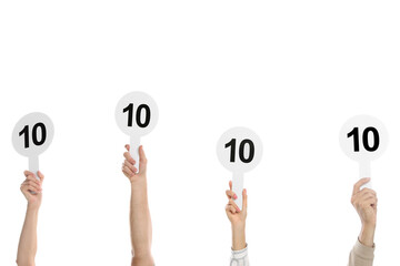 Panel of judges holding signs with highest score on white background, closeup