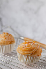 Delicious modern cruffins are made from layered croissants in the shape of a muffin Shaped like a cupcake. topping almond.