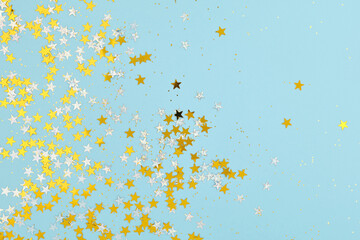 New Year, Christmas, or Birthday background. Scattered holiday confetti, stars and glitter.