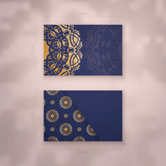 Business card in dark blue with abstract gold ornaments for your business.