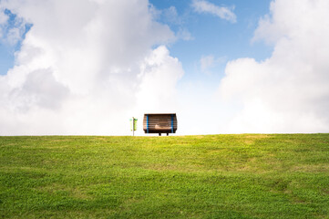 Bench and trash can with a sea view on the dike of Dagebüll in Schleswigholstein