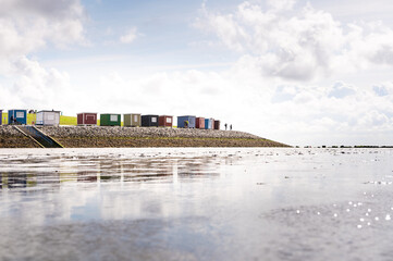 Colorful beach houses and bathhouses on the dike of Dagebüll