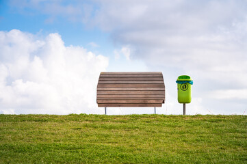 Bench and trash can with a sea view on the dike of Dagebüll in Schleswigholstein