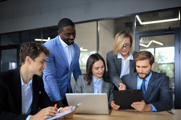 Group of business people in a meeting discussing and planning a project