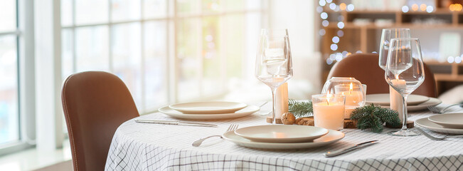 Beautiful table setting with Christmas decorations in living room