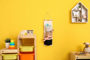 Stylish interior of modern children's room with toys