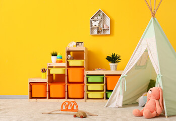 Stylish interior of modern children's room with play tent © Pixel-Shot