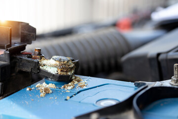 Close up battery terminals corrode dirty damaged problem, Old battery corrosion deteriorate leaking with blue acid powder. Service work by professional technicians concept.