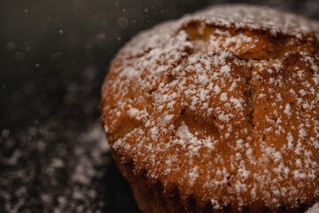 Close up delicious cupcake with sugar snow