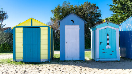 Obraz na płótnie Canvas Wooden beach cabins on the Oleron island in France, colorful huts 