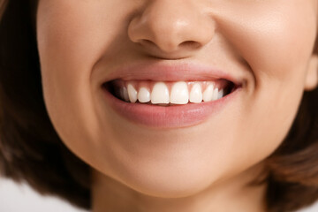 Young smiling woman with healthy gums, closeup