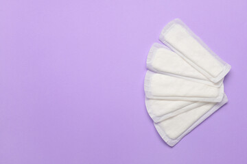 Menstrual pads on purple background