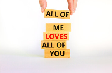 All of me loves all of you symbol. Wooden blocks with words All of me loves all of you on beautiful white background, copy space. Businessman hand. Lifestyle, love concept.