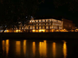 The reflection of the lights of Paris in the Seine river. October 2021, Paris France.