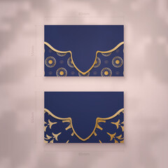 Business card template in dark blue with Indian gold ornaments for your business.