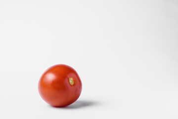 red tomato on a white background. High quality photo