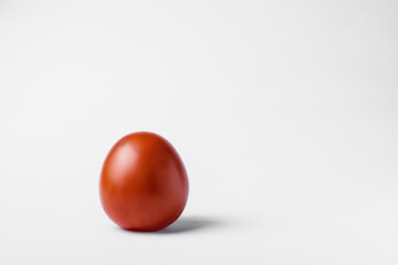 red tomato on a white background. High quality photo