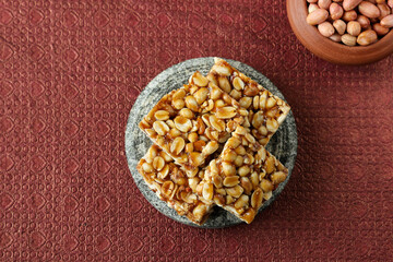 Peanut chkki peanut candy groundnut sweet Kappalndi Kadalai mittai Indian festival food snack Lohri Makar Sankranti Pongal Diwali harvest festival Tamil Nadu winter food festival Punjab North India.