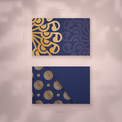 Business card template in dark blue with vintage gold ornaments for your business.