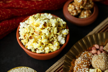 Popcorn popped corn popcorns pop-corn winter food Indian festival food snack sweet for Lohri Makar Sankranti Pongal Diwali harvest festival Tamil Nadu winter folk festival Punjab North India. 