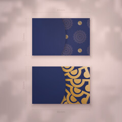 Business card template in dark blue with vintage gold pattern for your contacts.